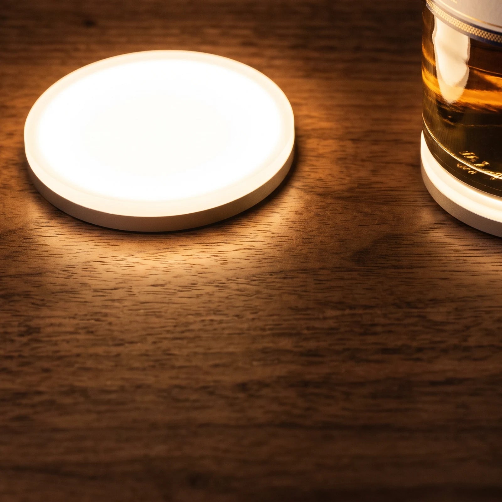 The light switched on beside the base of a bottle